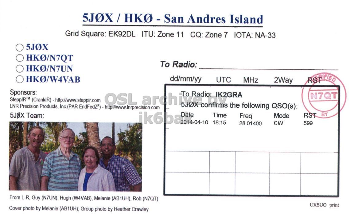 Right QSL card, of 5J0X to IK2GRA, April 10, 2014, CW mode. The QSL image contains the following objects: Adult, Male, Man, Person. And contains this text: Grid Square: EK92DL ITU: Zone 11 CQ: Zone 7 IOTA: NA-33 5JOX To Radio: dd/mm/yy UTC MHz 2Way Sponsors: SteppIR™ To Radio: IK2GRA N7QT 5JOX confirms the following QSO(s): RST BY 5JOX Team: ik6ba 2014-04-10 Date Time 18:15 Freq Mode CW 28.01400 599 From L-R, Guy (N7UN), Hugh (W4VAB), Melanie (AB1UH), Rob (N7QT) UX5UO print Cover photo by Melanie (AB1UH); Group photo by Heather Crawley.