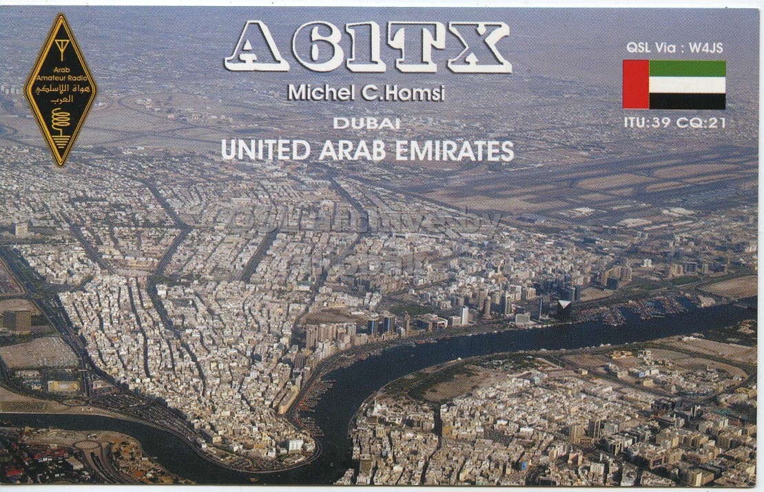 Front QSL card, of A61TX to IK6CQC, April 22, 2007, SSB mode. The QSL image contains the following objects: Outdoors, City, Urban. And contains this text: QSL Via : W4JS Arab Amateur Radio هواة اللاسلكي Michel C.Homsi العرب DUBAI ITU:39 CQ:21 UNITED ARAB EMIRATES QSL Via : W4JS Arab Amateur Radio هواة اللاسلكي Michel C.Homsi العرب DUBAI ITU:39 CQ:21 UNITED ARAB EMIRATES.