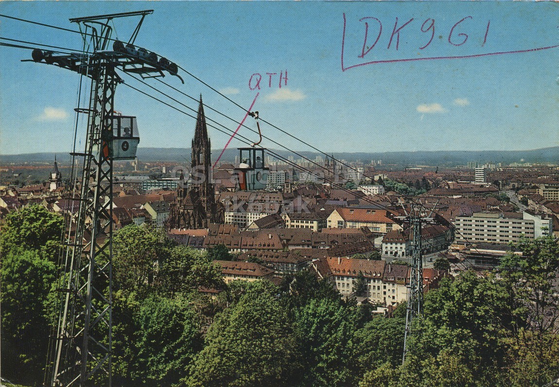Front QSL card, of DK9GI to I2LCN, September 24, 1972, SSB mode. The QSL image contains the following objects: City, Building, Urban. And contains this text: DK9.61 QTH DK9.61 QTH.