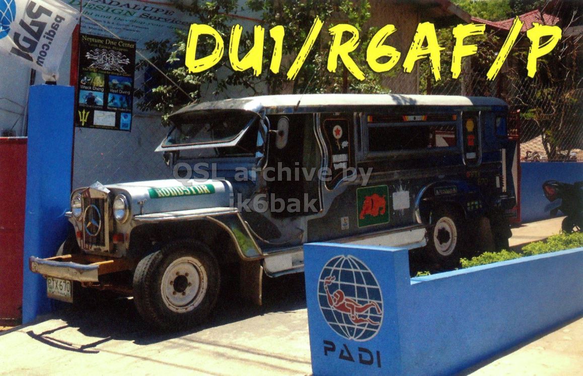 Front QSL card, of DU1/R6AF/P to IK2GRA, April 30, 2013, CW mode. The QSL image contains the following objects: Truck, Vehicle, Wheel. And contains this text: ALUPE ESIGN Service Neptune Dive Center OSL archiveby ik6bak PTX670 PADI ALUPE ESIGN Service and Neptune Dive Center Diving Due OSL archiveby ik6bak PTX670 PADI.
