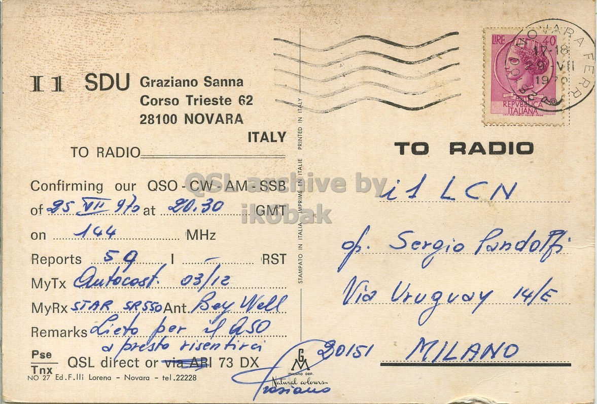 Right QSL card, of I1SDU to I1LCN, July 25, 1970, PH mode. The QSL image contains the following objects: Envelope, Mail, Postcard, Face, Person. And contains this text: LIRE Il SDU Graziano Sanna Corso Trieste 62 28100 NOVARA ITALY PRINTED IN ITALY TO RADIO TO RADIO ITALIE of 25 V 970 at 20.30 144 on MHz RST Tnx NO Ed.F.lli Lorena - Novara - tel Remarks MyTx MyRx 27 QSL STAR autocost. Lieto direct d presto SR550Ant. per or via ARI .22228 risen 03/12 Boy if 73 tira aso Well varians STAMPATO IN ITALIA Via Uruguay 14/E Pse MILANO LIRE SDU Graziano Sanna Corso Trieste 62 REPVBBLICA ITALIANA O 1979 40 18 VII FERRY 28100 NOVARA ITALY PRINTED IN ITALY TO RADIO TO RADIO Confirming our LCN ITALIE of at 20.30 144 on MHz Reports RST Sergio Tnx NO Lorena - Novara - tel Remarks MyTx MyRx 27 QSL STAR Lieto direct d presto SR550Ant. per or .22228 risen 03/12 Boy 73 aso Well STAMPATO IN ITALIA Via Uruguay 14/E Pse MILANO.