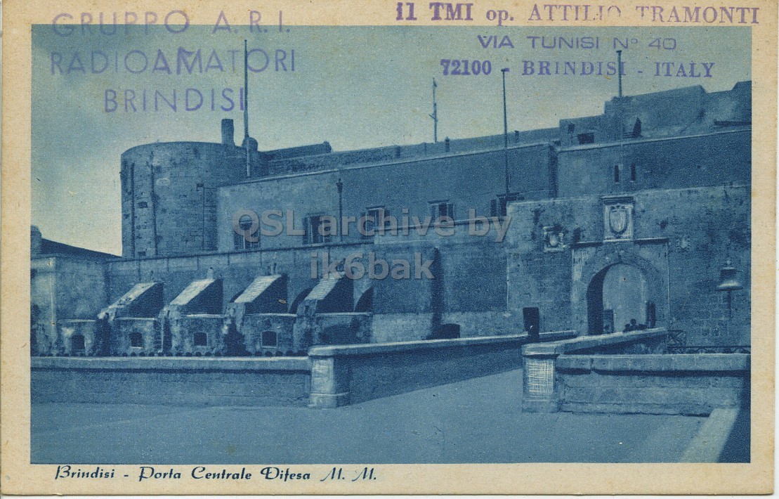 Front QSL card, of I1TMI to I1LCN, November 15, 1967, PH mode. The QSL image contains the following objects: Building, Monastery, Brick, Fortress, Person. And contains this text: il TMI op. ATTILIO TRAMONTI GRUPPO A.R.I. VIA TUNISI N° 40 RADIOAMATORI 72100 BRINDISI QSL archive by ik6bak il TMI ATTILIO TRAMONTI GRUPPO A.R.I. VIA TUNISI N° 40 RADIOAMATORI 72100 BRINDISI QSL archive by ik6bak Brindisi - Porta Centrale.