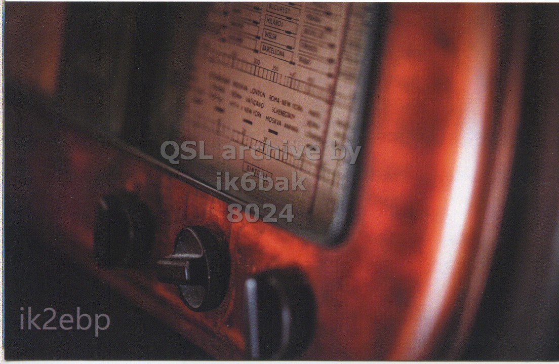 Front QSL card, of IK2EBP to IK6BAK, May 23, 2014, PSK31 mode. The QSL image contains the following objects: Electronics, Radio. And contains this text: MILANO WELSH BARCELLONA 300 350 - GATICANO ik6bak 8024 ik2ebp.