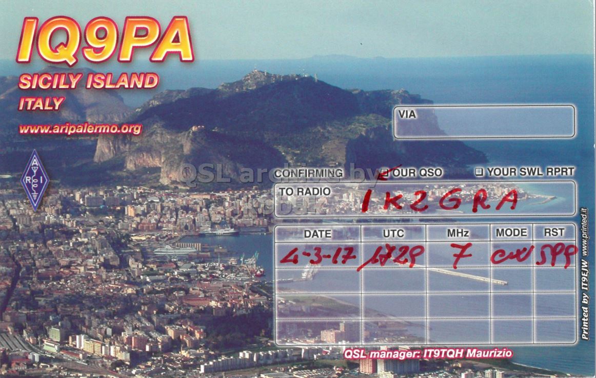 Right QSL card, of IQ9PA to IK2GRA, March 4, 2017, CW mode. The QSL image contains the following objects: City, Urban, Outdoors, Metropolis, Waterfront. And contains this text: IQ9PA SICILY ISLAND ITALY VIA www.aripalermo.org R YOUR SWL RPRT TO RADIO IK2GRA MHz MODE RST UTC DATE 4-3-17 1728 7 Printed by IT9EJW www.printed.it QSL manager: IT9TQH Maurizio.
