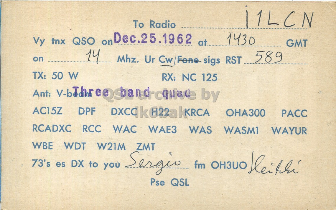Right QSL card, of OH3UO to I1LCN, December 25, 1962, PH mode. The QSL image contains the following objects: Book. And contains this text: To Radio Vy tnx QSO on Dec.25.1962 at 1430 GMT on 14 a Mhz. Ur Cw/Fone sigs RST 589 TX: 50 W RX: NC 125 Ant: by AC15Z DPF PACC RCADXC RCC WAC WAE3 WAS WASMI WAYUR WBE WDT W21M ZMT 73's es DX to you Sergio fm OH3UO Kleihhi Pse QSL To Radio Vy tnx QSO on Dec.25.1962 at 1430 GMT on 14 Mhz. Ur sigs RST 589 TX: 50 W RX: NC 125 Ant: by AC15Z DPF PACC RCADXC RCC WAC WAE3 WAS WASMI WAYUR WBE WDT W21M ZMT 73's es DX to you Sergio fm OH3UO Pse QSL.