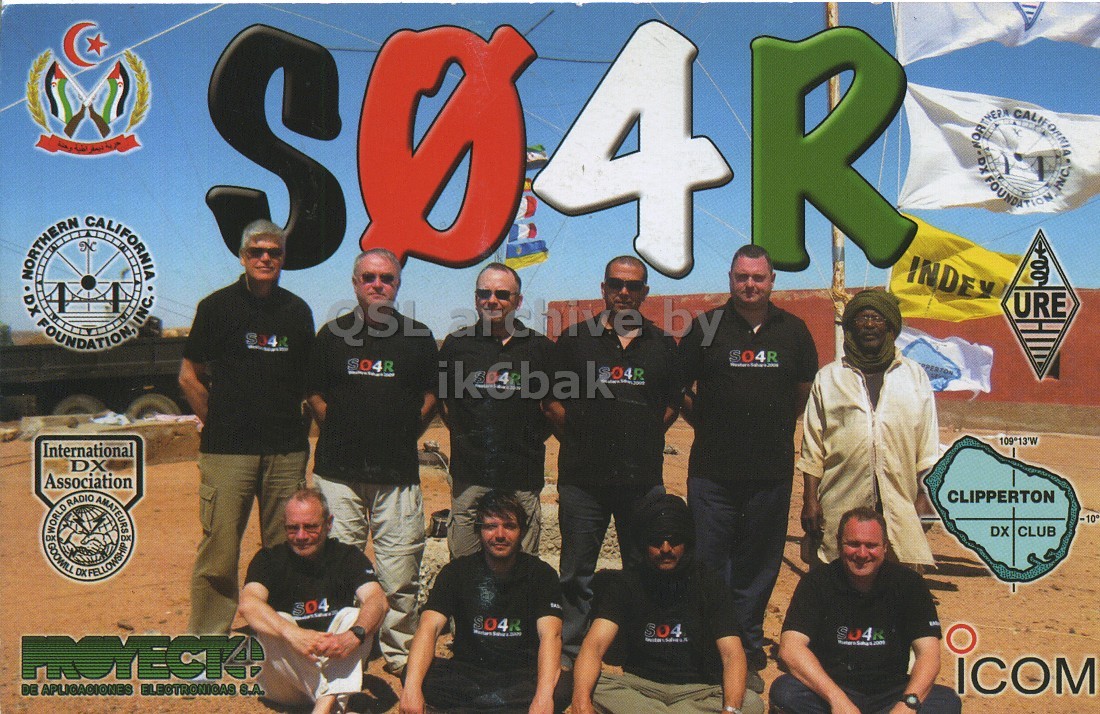 Front QSL card, of S04R to IK6CQC, October 4, 2009, SSB mode. The QSL image contains the following objects: People, Person, T-Shirt, Adult, Man. And contains this text: S NORTHERN DX FOUNDATIONA CALIFORNIA INC. INDEY URE QSL archive by SO4R SO4R 109°13'W International DX Association CLIPPERTON -10° DX CLUB 3 04 S 04R ICOM DE APLICACIONES ELECTRONICAS S.A. حرية S NORTHERN DX CALIFORNIA INC. A FOUNDATION CALIFORNIA INC. INDEY URE QSL archive by SO4R SO4R ikobak 109°13'W International DX Association CLIPPERTON -10° WORLD GOOWILL RADIO AMATEURS DX CLUB 04 S ICOM DE S.A..