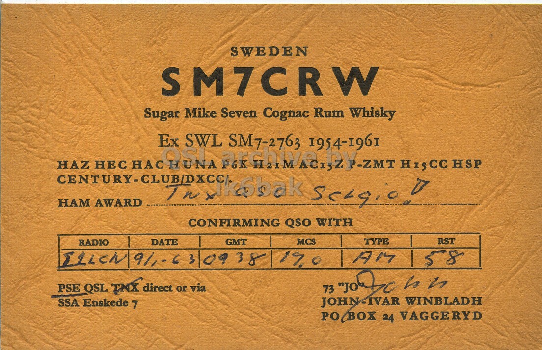 Front QSL card, of SM7CRW to I1LCN, January 9, 1963, AM mode. The QSL image contains the following objects: Book. And contains this text: SWEDEN SM7CRW Sugar Mike Seven Cognac Rum Whisky Ex 1954-1961 OSI HUNA SWL Dreamstime SM7-2763 H15CC HSP HAZ НАМ НЕС AWARD НАС P6K seegic! CONFIRMING QSO WITH GMT MCS TYPE RST RADIO DATE PSE QSL TNX direct or via SSA Enskede 7 JOHN-IVAR WINBLADH PO BOX 24 VAGGERYD SWEDEN SM7CRW Sugar Mike Seven Cognac Rum Whisky Ex 1954-1961 HUNA SWL SM7-2763 H15CC HSP HAZ НАМ НЕС AWARD НАС P6K CONFIRMING QSO WITH GMT MCS TYPE RST RADIO DATE 09 38 19.0 AM 158 PSE QSL direct or via SSA Enskede 7 73 h JOHN-IVAR WINBLADH 24 VAGGERYD.