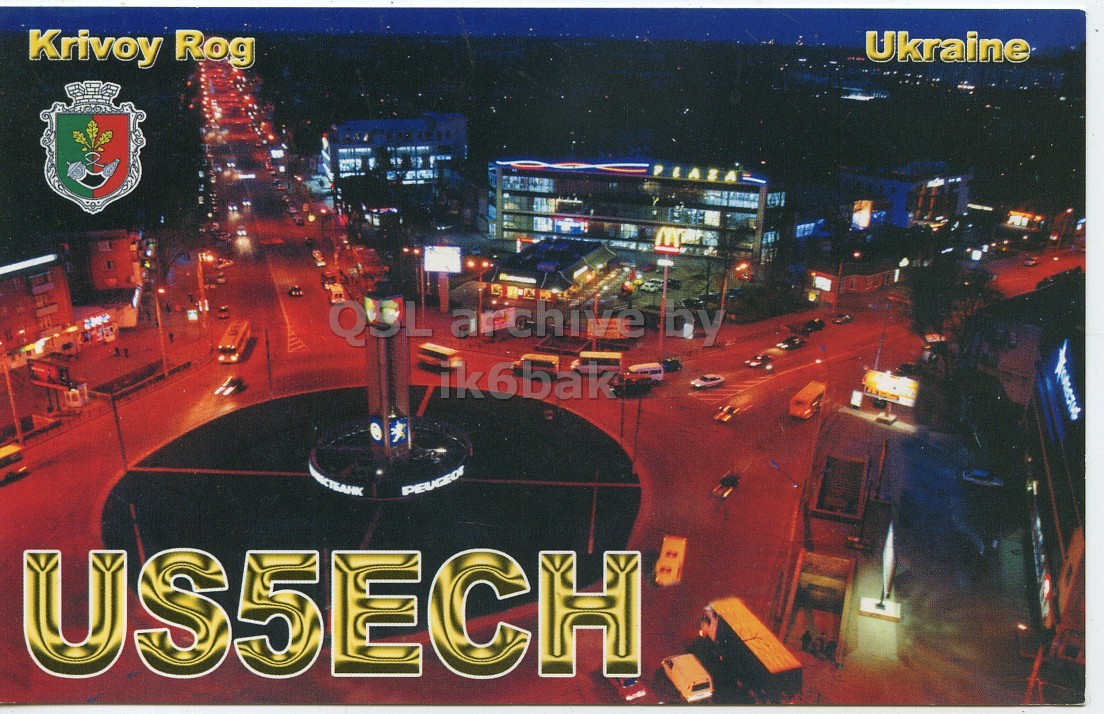 Front QSL card, of US5ECH to IK6CQC, June 2, 2009, SSB mode. The QSL image contains the following objects: City, Urban, Metropolis, Road, Downtown. And contains this text: Ukraine Krivoy Rog by ik6bak СТБАНК PEUGEOT Ukraine Krivoy Rog by ik6bak СТБАНК PEUGEOT.