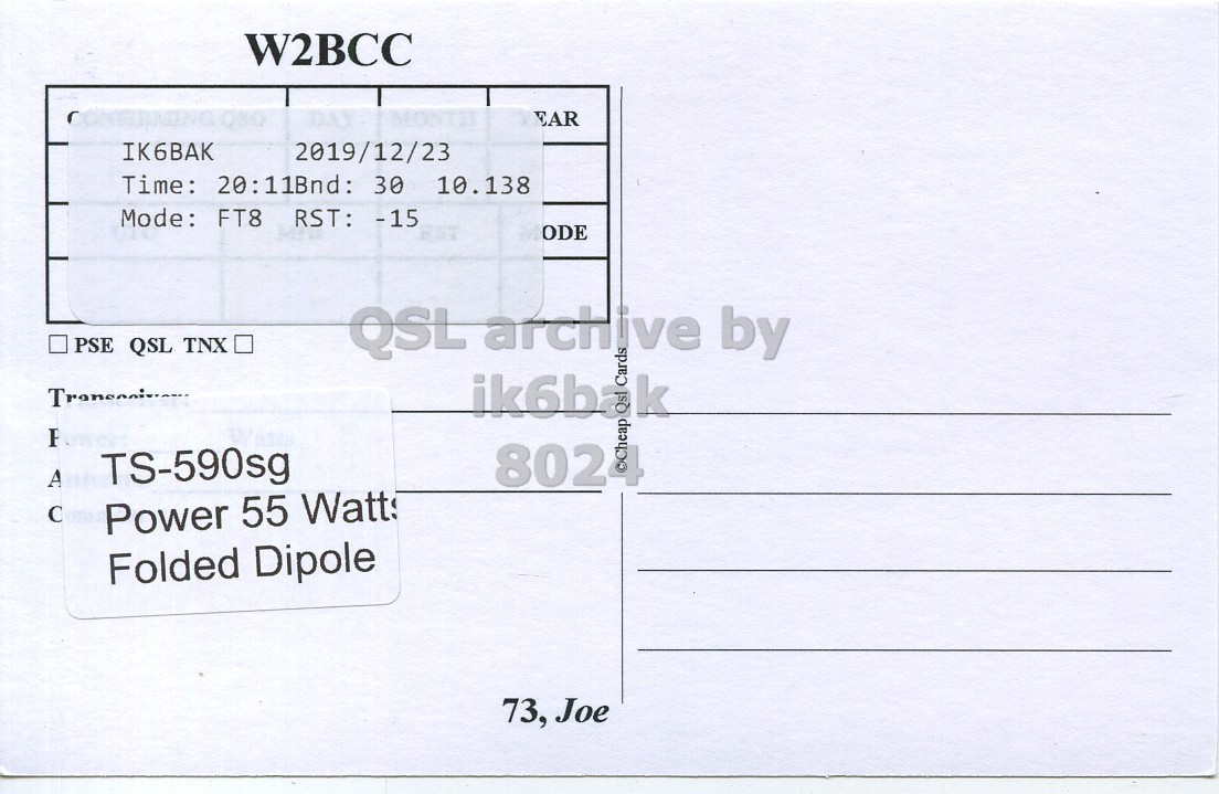 Right QSL card, of W2BCC to IK6BAK, December 23, 2019, FT8 mode. The QSL image contains the following objects: Envelope, Mail, Postcard. And contains this text: W2BCC DAY MONTH EAR IK6BAK 2019/12/23 Time: 20:11Bnd: 30 10.138 Mode: FT8 RST: -15 ODE PSE QSL TNX ik6bak Cards A TS-590sg Power 55 Watt Folded Dipole 73, Joe.